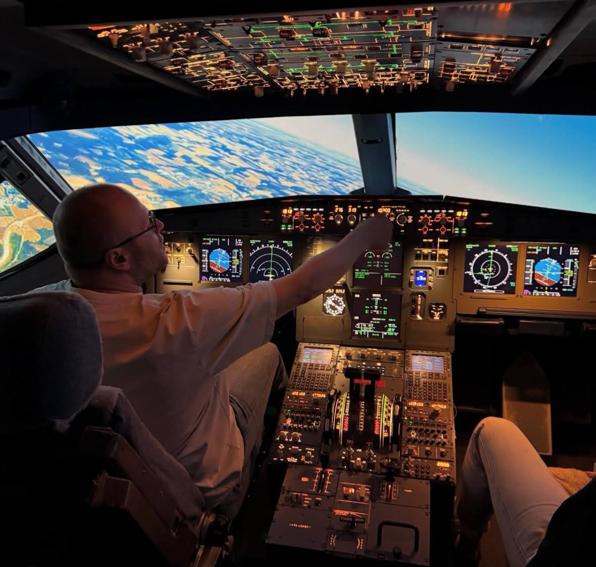 Alex Gervash in an Airbus A320 cockpit simulator