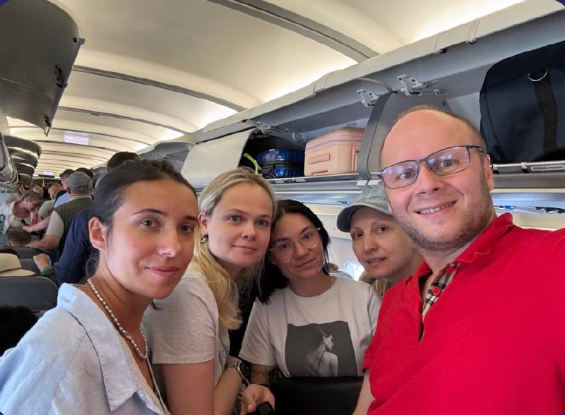 Alex Gervash with course participants on board an aircraft